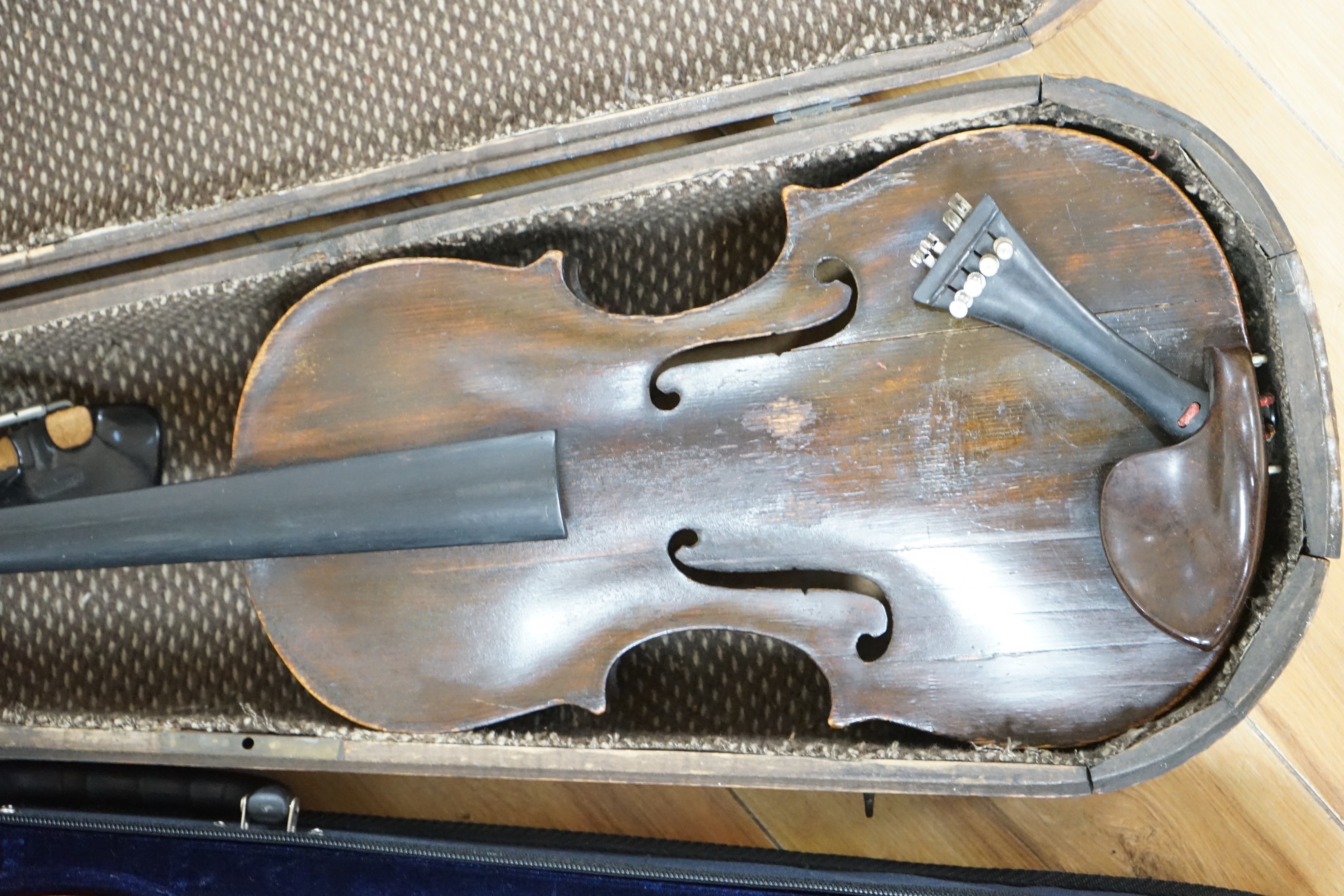 Two cased unnamed violins